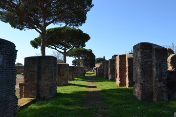 Ancient Roman Street in Ostia Antica with brick houses Rome Italy 