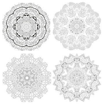 Hand drawn zentangle set of 4 mandalas for coloring page.