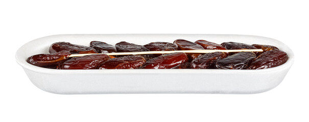 Dried dates with plastic stick in open white foam retail container isolated on white background