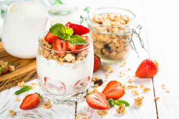 Greek yogurt with fresh strawberry and granola. Parfait.