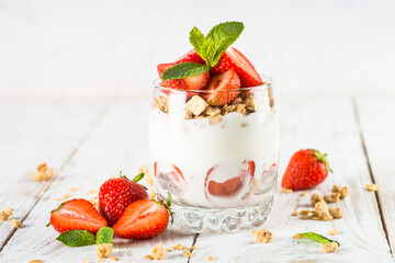 Greek yogurt with fresh strawberry and granola. Parfait.