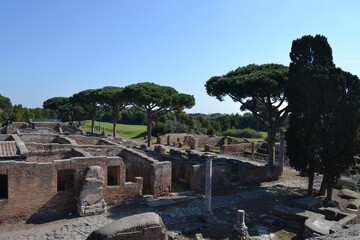 Fototapeta na wymiar Panorama of roman ruins at the archeological site of Ostia Antica Rome Italy empty on a sunny day 