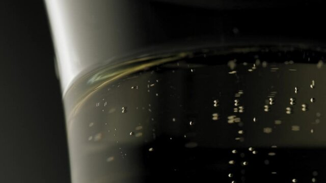 Champagne bubbles going up in super slow motion