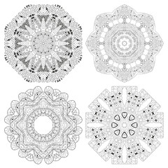 Hand drawn zentangle set of 4 mandalas for coloring page.