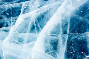 Ice on the river with cracks and bubbles