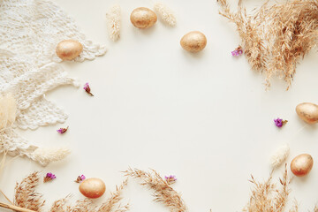 Fototapeta na wymiar Happy Easter concept. Beige minimalism background with cope space, top view banner