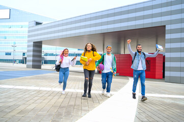 Happy young friends making victory sign for the end of school - Multiracial teenagers with face mask enjoying time together and having fun - New normal lifestyle concept friendship in covid time