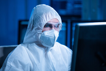 Microelectronics engineer works in a modern scientific laboratory on computing systems and...