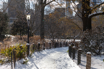 Beautiful Empty Winter Trail at Central Park Covered with Snow in New York City