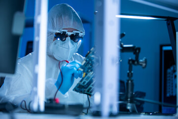 Microelectronics engineer works in a modern scientific laboratory on computing systems and...