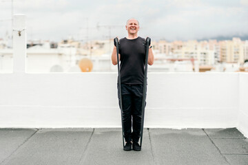 A man exercising with gum on the rooftop during lockdown