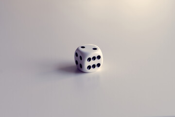 White dice isolated on the white background with pastel colors tones