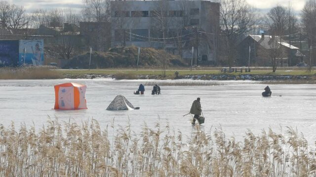 The sea water turned into ice during the winter and some people going on fishing in Parnu in Estonia