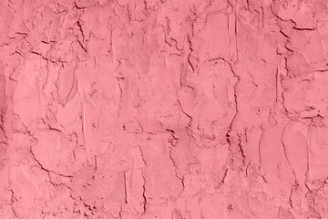 A dusty rose-colored grungy wall, a creative copy of the space,
