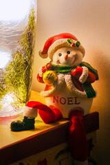 Snowman dressed as Santa sits out on Christmas.  This cute Noel figurine helps spread the Yule time...