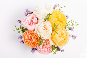 Beautiful bouquet with pink, yellow and coral roses on white background.