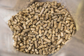 closeup of straw pellets in a bag