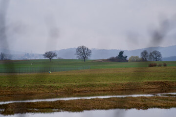Rural landscape scenery with fields and trees at Kloten, Switzerland.