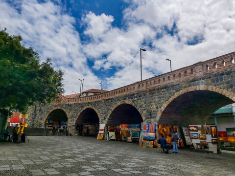 Cuenca, Ecuador; November 4 of 2019: Art fair under the "Broken Bridge", near the Tomebamba river