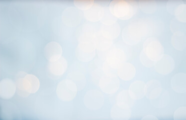 Bokeh. Blurred, defocused, transparent lights on a blue background. Can also be used as an overlay in overlay (screen) mode.