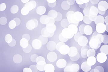 Bokeh. Defocused white lights on purple background