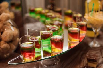 Sweet cakes at a wedding banquet. Catering, sweet festive buffet. Candy bar