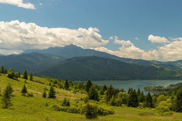 Fototapeta na wymiar The mountain and the lake. Romania, Mount Ceahlau and the lake Izvorul Muntelui