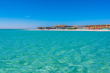Orange Bay with white beach and crystal clear azure water - paradise coastline of Giftun island,...