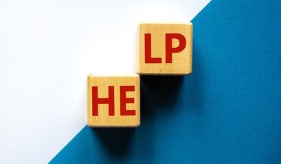 Support and help symbol. Wooden cubes with the word 'help'. Business, psychology, support and help concept. Beautiful blue and white background, copy space.