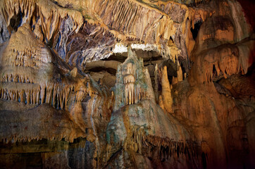Stalagmites and stalactites rock formations inside cave in Baume-les-Messieurs, France, Europe.