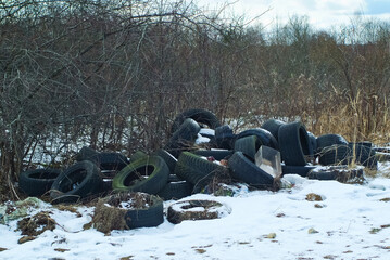 car tires discarded in the woods