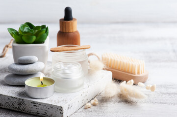 Cosmetic jar with cream and essential oil