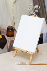 Blank canvas on easel. Creativity workshop, education. Creative hobby. Art lesson. Artist equipment