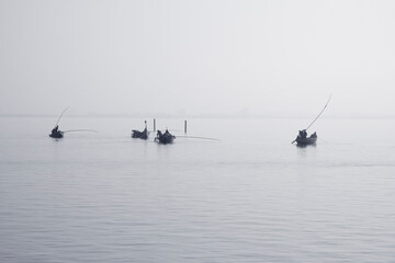 Fototapeta premium Traditional fishing boats during toil