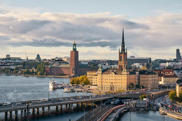 Bridges, railway tracks, church tower, cityscape and water canal, Stockholm, Sweden