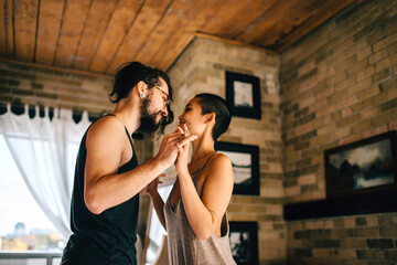 Couple slow dancing at home