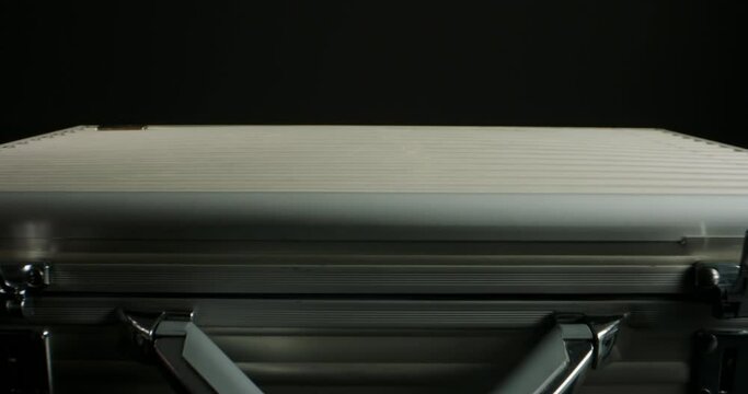 Close up shot of briefcase full of 100 US dollars packs getting opened. A suitcase stuffed with cash. Currency, cash flow, business and financing 4k footage