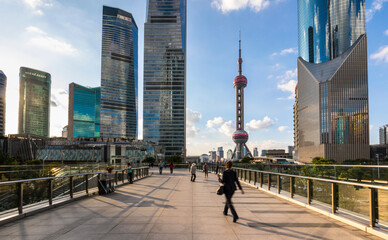 Pudong skyline with Oriental Pearl Tower from elevated walkway, Shanghai, China