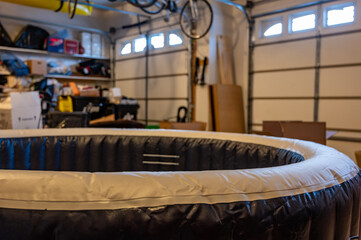 inflatable indoor hot tub inside a residential garage