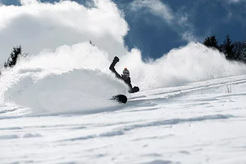  Male snowboarder speeding down mountainside, low angle view, Alpe-d'Huez, Rhone-Alpes, France © Image Source