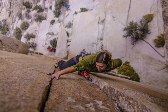 Climber trad climbing, Pine Creek, Bishop, California, USA