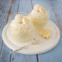 Millet cooked in coconut milk with the addition of maple syrup and coconut shavings.