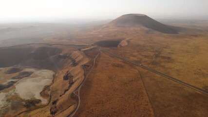 Mars rover moving on a road near volcanic cone and crater on red planet. Exploring martian landscapes and outer space from a space ship - Powered by Adobe