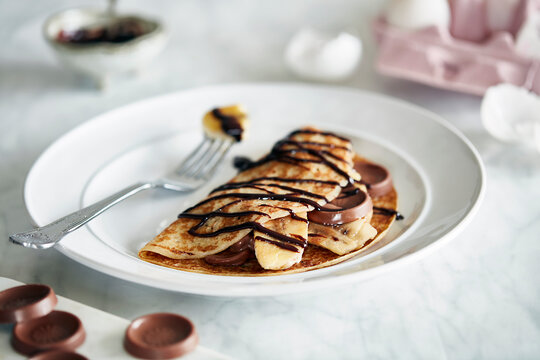 Banana chocolate pancake with chocolate sauce