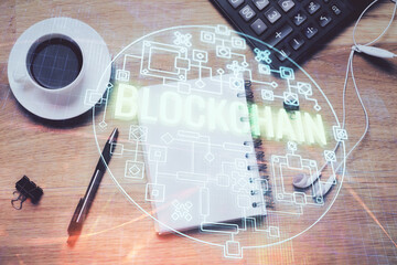 Multi exposure of crypto theme drawing and work table top veiw. Concept of blockchain technology in...