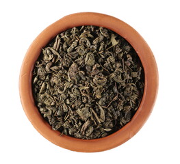 Green tea leaves in clay pot isolated on white background, top view