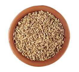 Oats grain peel in clay pot isolated on white background, top view