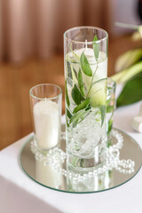 Beautiful decoration of the wedding holiday with flowers and greenery with florist decoration