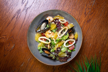 Mix of salad with shrimps, avocado and cherry tomatoes. Healthy food top view