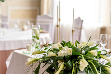 Beautiful decoration of the wedding holiday with flowers and greenery with florist decoration